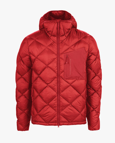 The Mountain Studio D-7 UL men’s red down jacket with diamond quilted pattern, storm hood, and zippered chest pocket, shown in a front-facing view highlighting its minimalist alpine design.