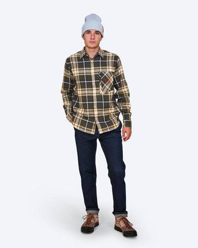 The Mountain Studio G-2 Cotton Flannel Overshirt in Peat, on model front, with beanie