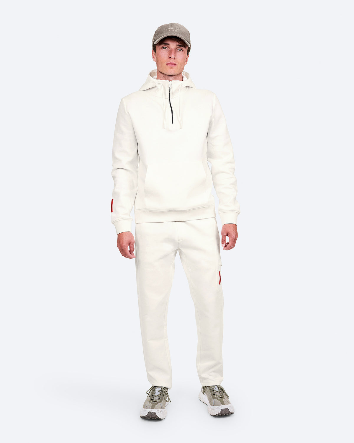 The Mountain Studio H-9 Cotton Tech Hood Half Zip and J-14 Cotton Tech Pants in White Alyssum, on model front image