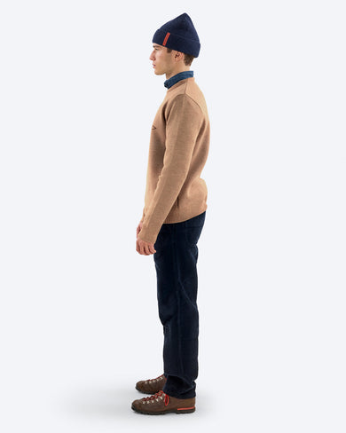 K-3 TMS Ski Sweater in Otter, on model side, with beanie