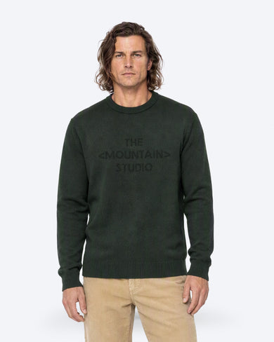 The Mountain Studio K-3 TMS Ski Sweater in Peat, close-up on model front