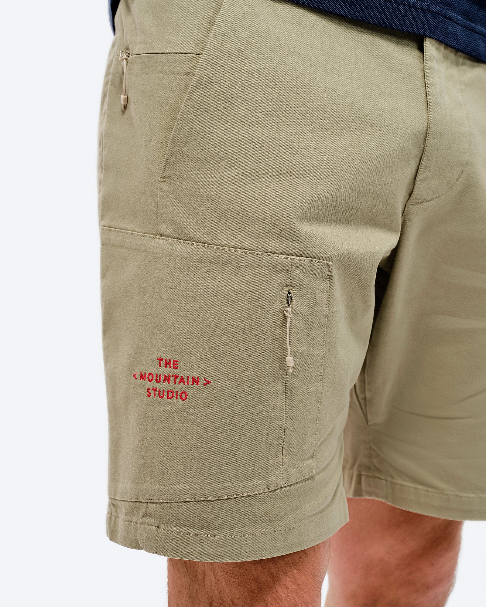 Leg pocket with zip and embroidery. card image