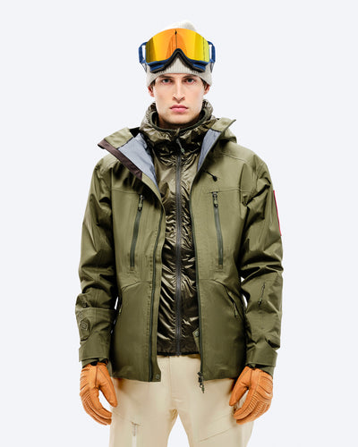 The Mountain Studio Z-2 EPE GORE-TEX ePE 3L Shell Jacket in Winter Moss, on model front, worn open over a vest