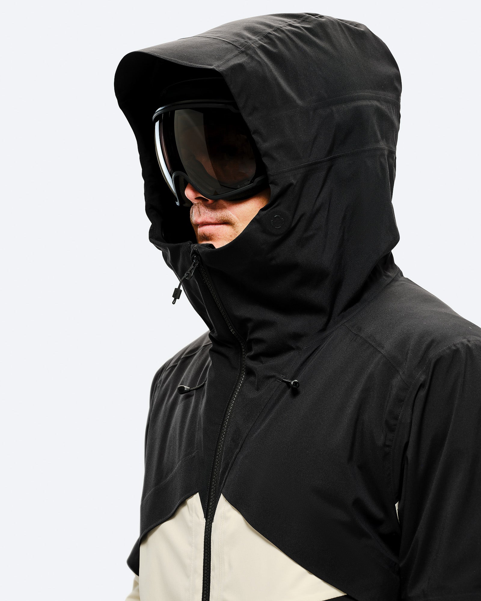 Adjustable, helmet compatible hood with laminated visor for optimal visibility in bad conditions card image